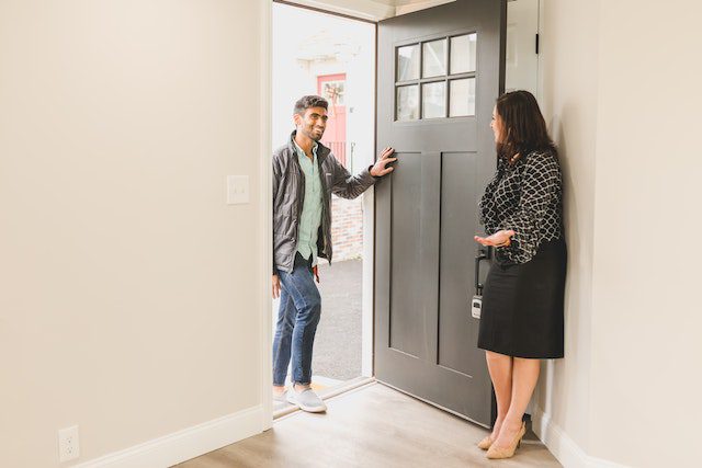 Real estate agent showing a property to a client