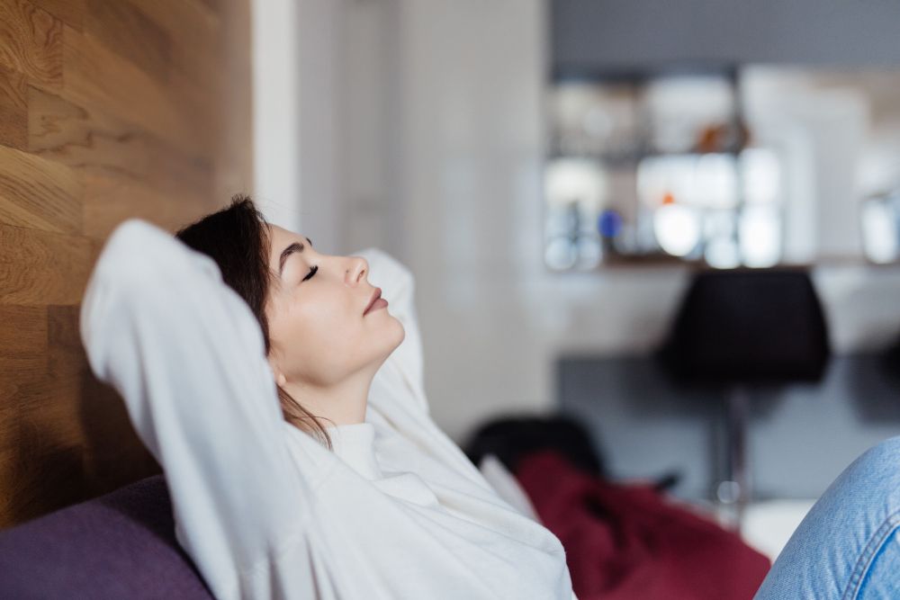 Woman relaxing in her home.
